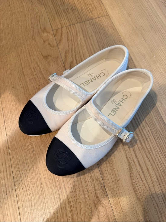 CHANEL Shoes - CHANEL Two-Tone Mary Jane Flats - Ivory and Black Cap